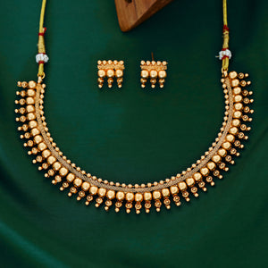 Antique gold beaded choker necklace with triple-layer gold ball beads, temple-inspired detailing, and matching earrings.