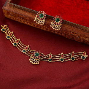 Traditional ruby emerald kundan choker with crescent pendant, pearl hangings, antique gold finish, and matching earrings.