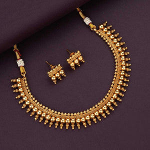 Antique gold beaded choker necklace with triple-layer gold ball beads, temple-inspired detailing, and matching earrings.