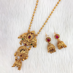 Traditional South Indian Sita necklace with peacock motif, floral embossed pendant, deep ruby stone, ghungroo beads, and matching jhumka earrings.