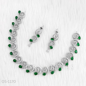 Emerald Green Diamond Cut Spiral Necklace Set with droplet stones and matching earrings – elegant swirl design – Ornatales