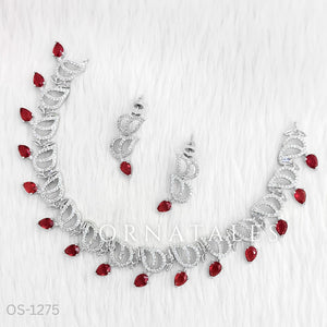 Ruby Red Diamond Cut Necklace Set with wave-like looping structure and droplet stones – matching earrings – Ornatales