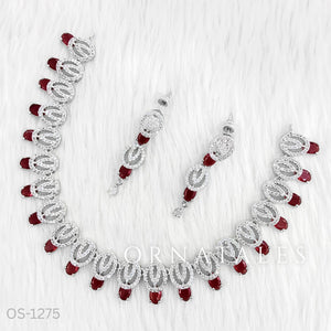 Ruby Red Diamond Cut Necklace Set featuring spiral motifs with teardrop stones – Ornatales