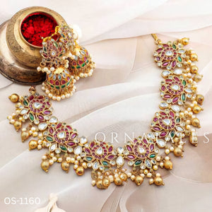 Padmarekha Heritage necklace set with pink-red lotus motif, green and white kundan stones, and golden pearl drops in temple jewellery style.