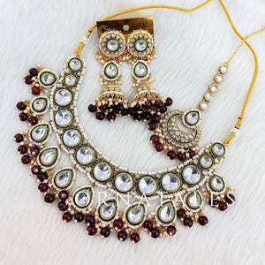 Maroon Pearl Kundan Necklace Set featuring Rajwada drop motif with green meenakari border & hanging pearls – Perfect for bridal look – Ornatales