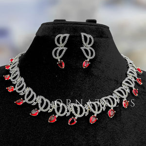 Ruby Red Diamond Cut Necklace Set with wave-like looping structure and droplet stones – matching earrings – Ornatales