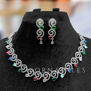 Multicolor Diamond Cut Spiral Necklace Set featuring spiral motifs with colorful stones and matching earrings – festive jewellery – Ornatales