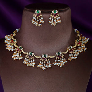 Padmashree Regal lotus-inspired Kundan choker with ruby, emerald, and pearl details, gold base, and delicate pearl fringe edging.