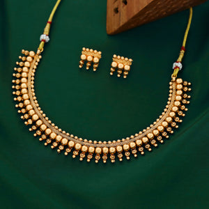 Antique gold beaded choker necklace with triple-layer gold ball beads, temple-inspired detailing, and matching earrings.