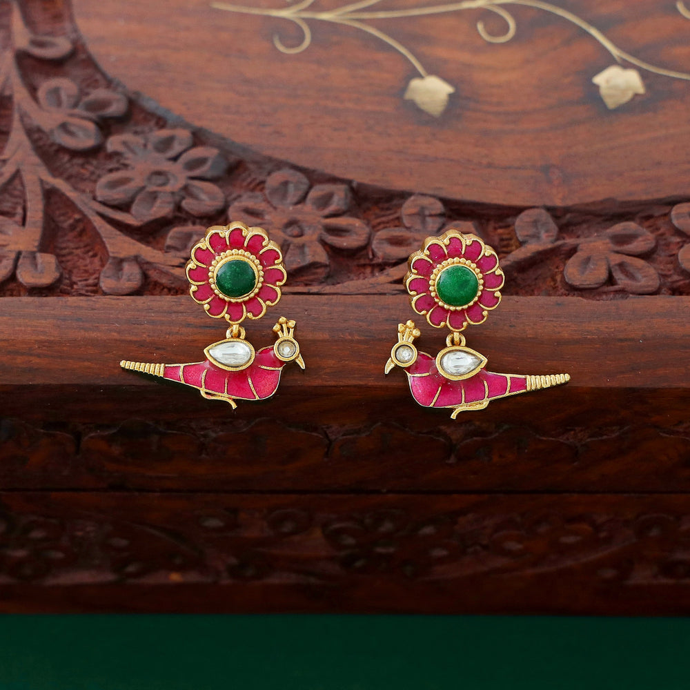 Temple-style ruby necklace with peacock and lotus motifs, pearl accents, and antique gold finish.