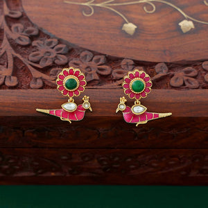 Temple-style ruby necklace with peacock and lotus motifs, pearl accents, and antique gold finish.
