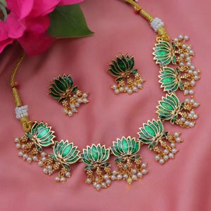 Kamalini Pearl Drop Choker Set with emerald green lotus motifs, golden detailing, hanging pearl clusters, and matching lotus drop earrings.