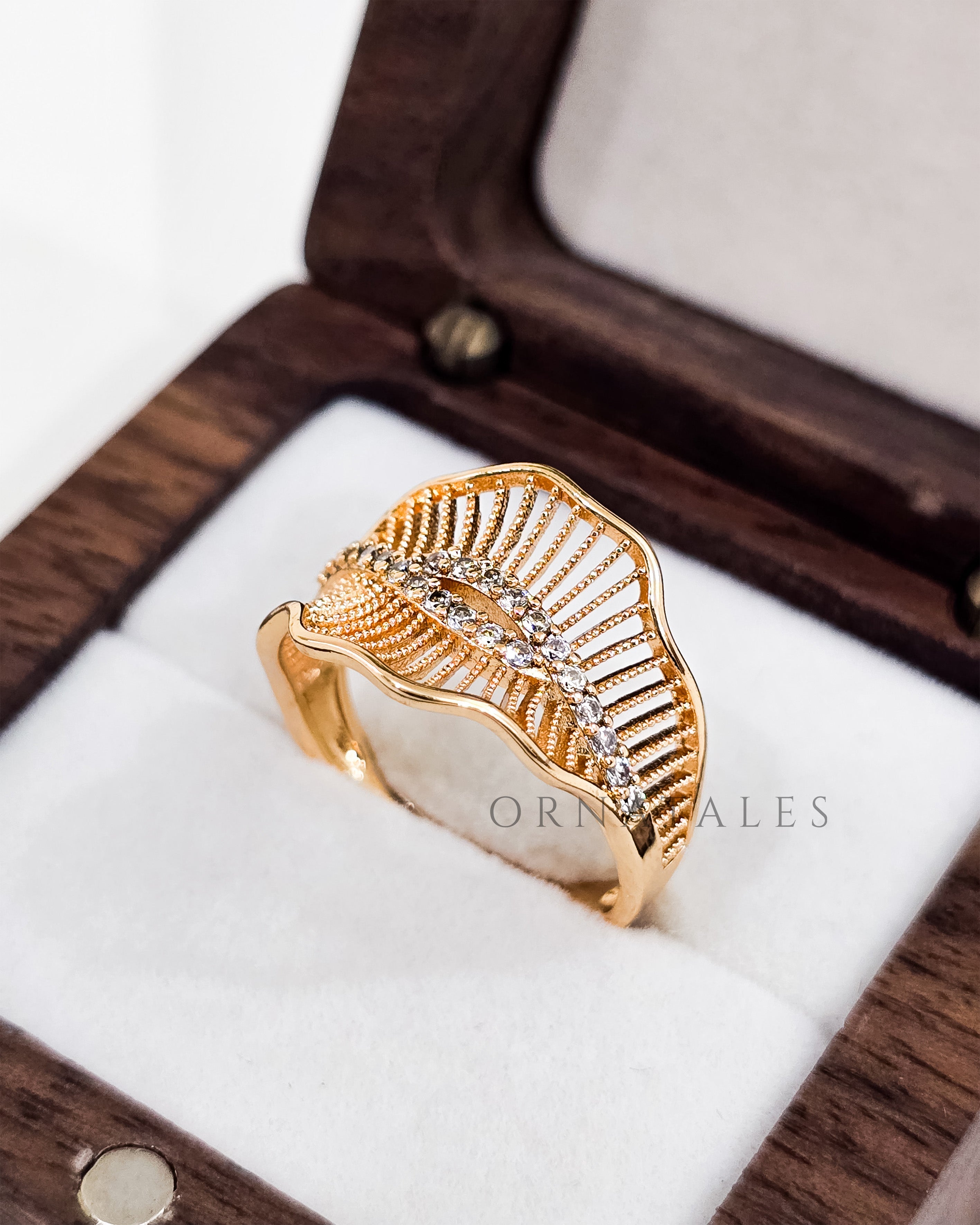 Gold plated adjustable ring with zircon stones and engraved pattern