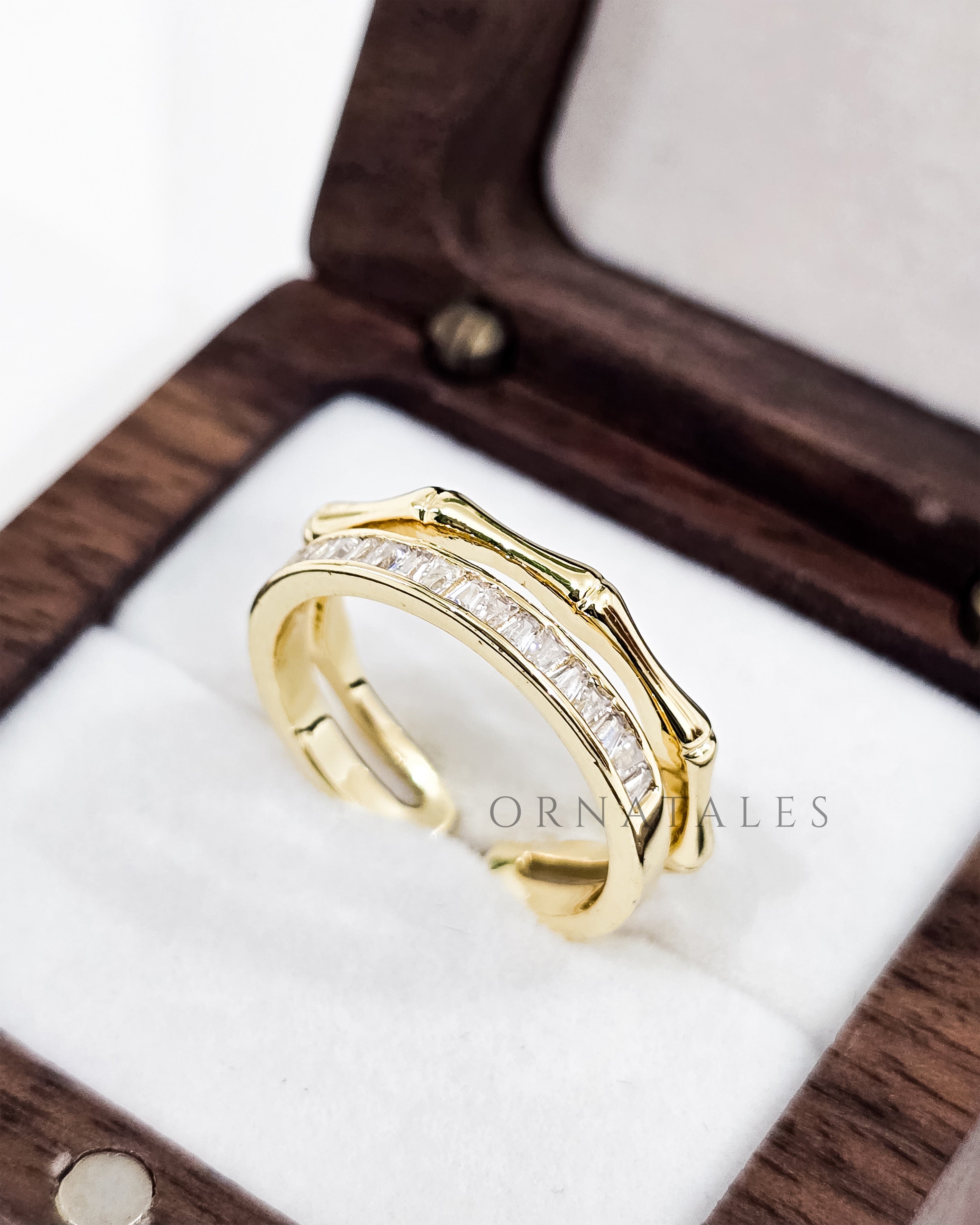 Gold plated adjustable ring with zircon stones and engraved pattern