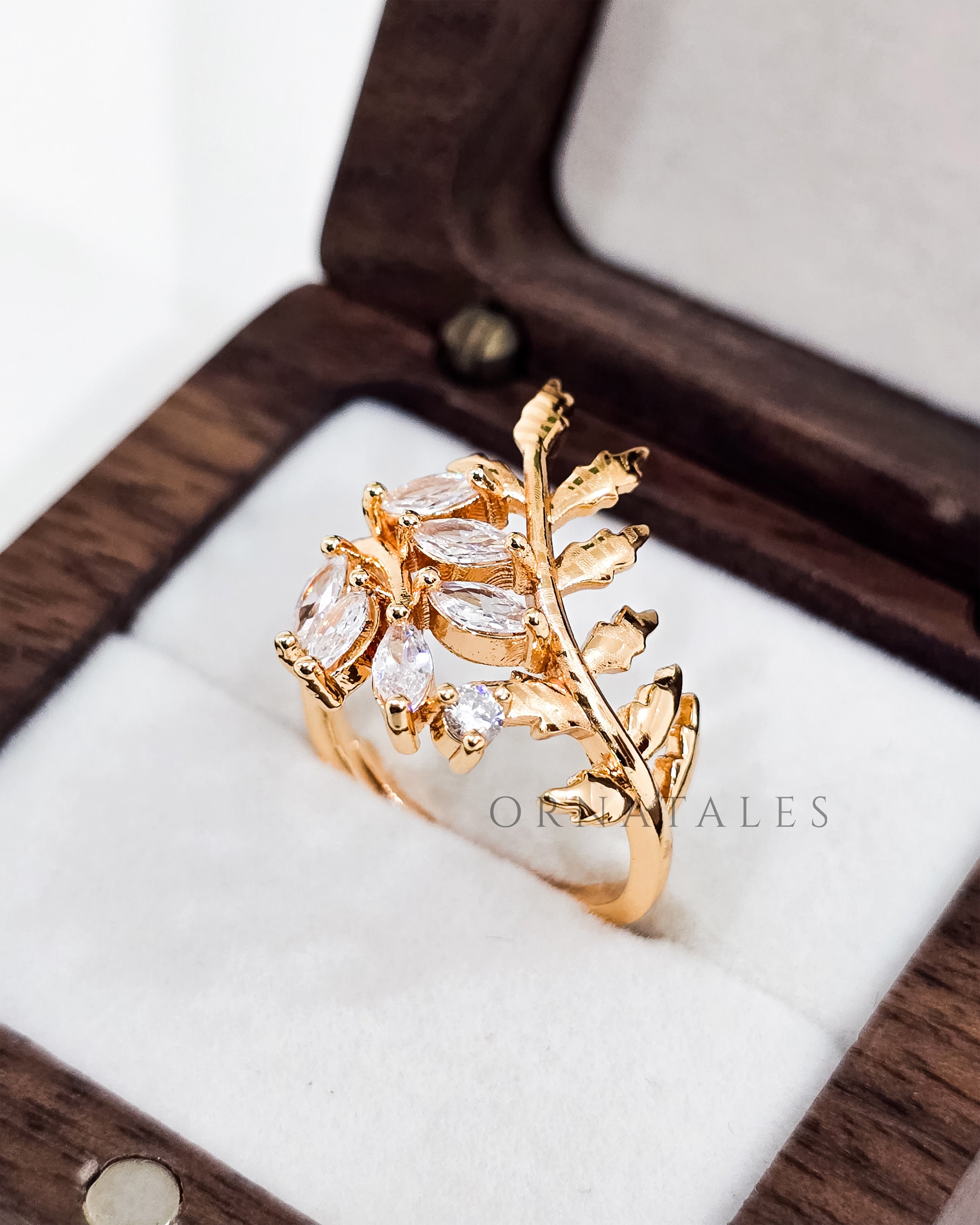 Gold plated adjustable ring with zircon stones and engraved pattern