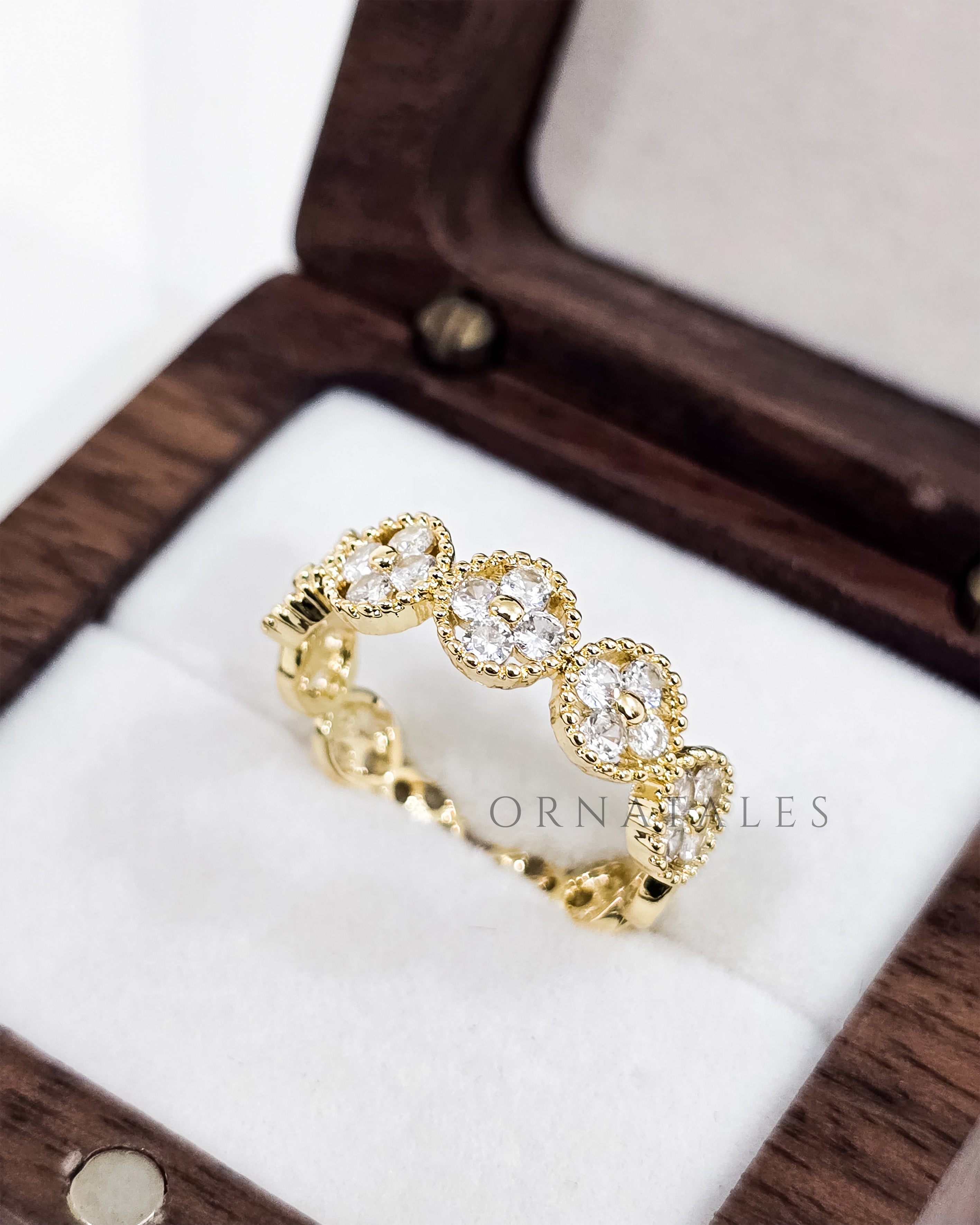 Gold plated adjustable ring with zircon stones and engraved pattern