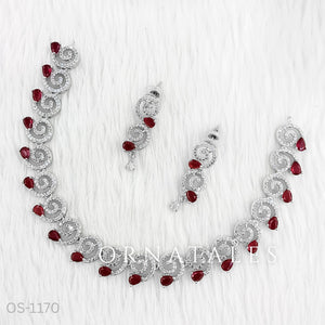 Ruby Red Diamond Cut Spiral Necklace Set with droplet stones and matching earrings – elegant swirl design – Ornatales