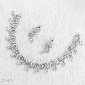 Crystal White Diamond Cut Necklace Set with wave-like looping structure and droplet stones – matching earrings – Ornatales