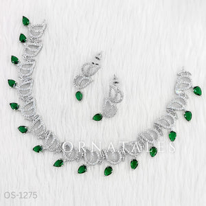 Emerald Green Diamond Cut Necklace Set with wave-like looping structure and droplet stones – matching earrings – Ornatales