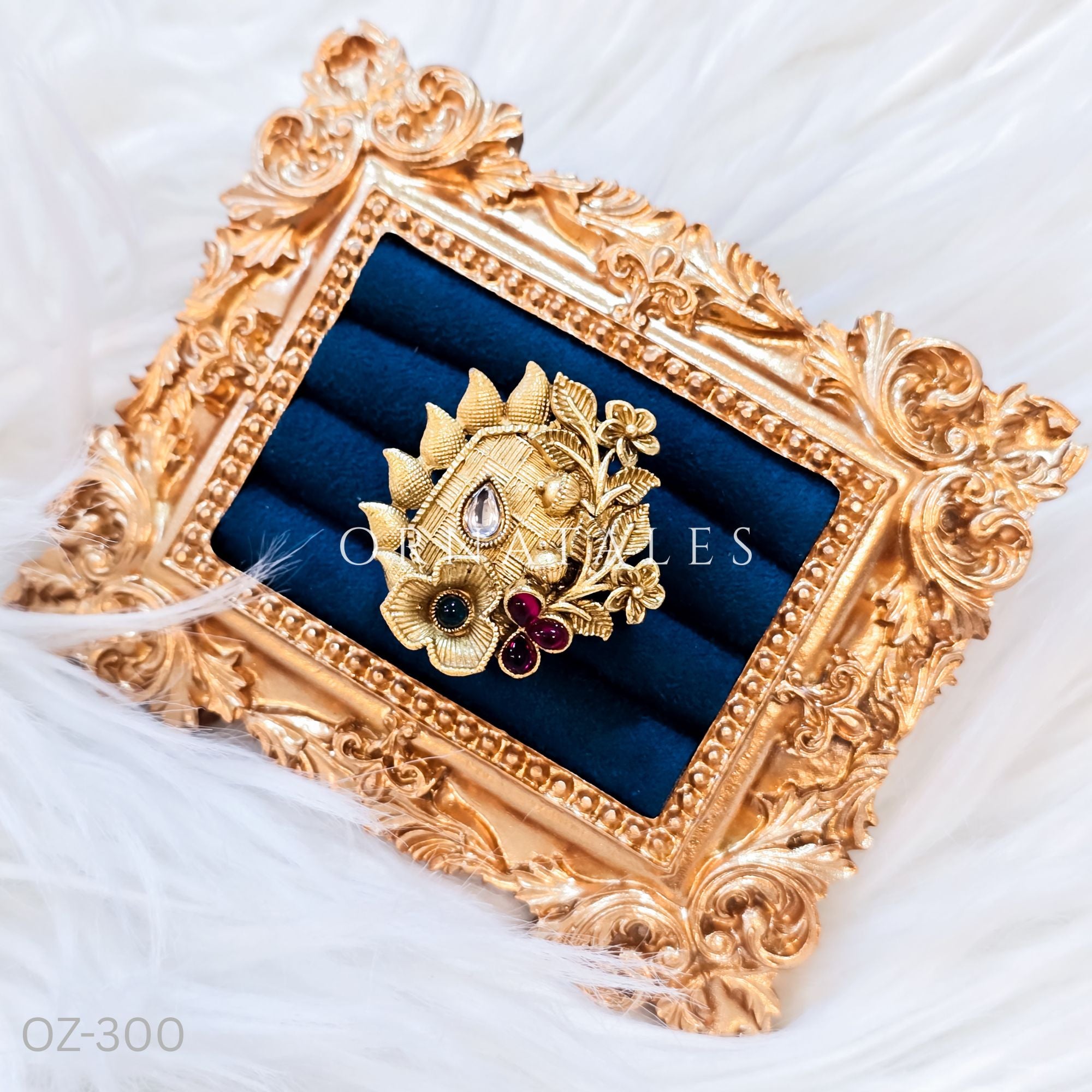 South Indian temple-inspired ring with matte gold finish, adjustable size, and traditional embossed motifs.