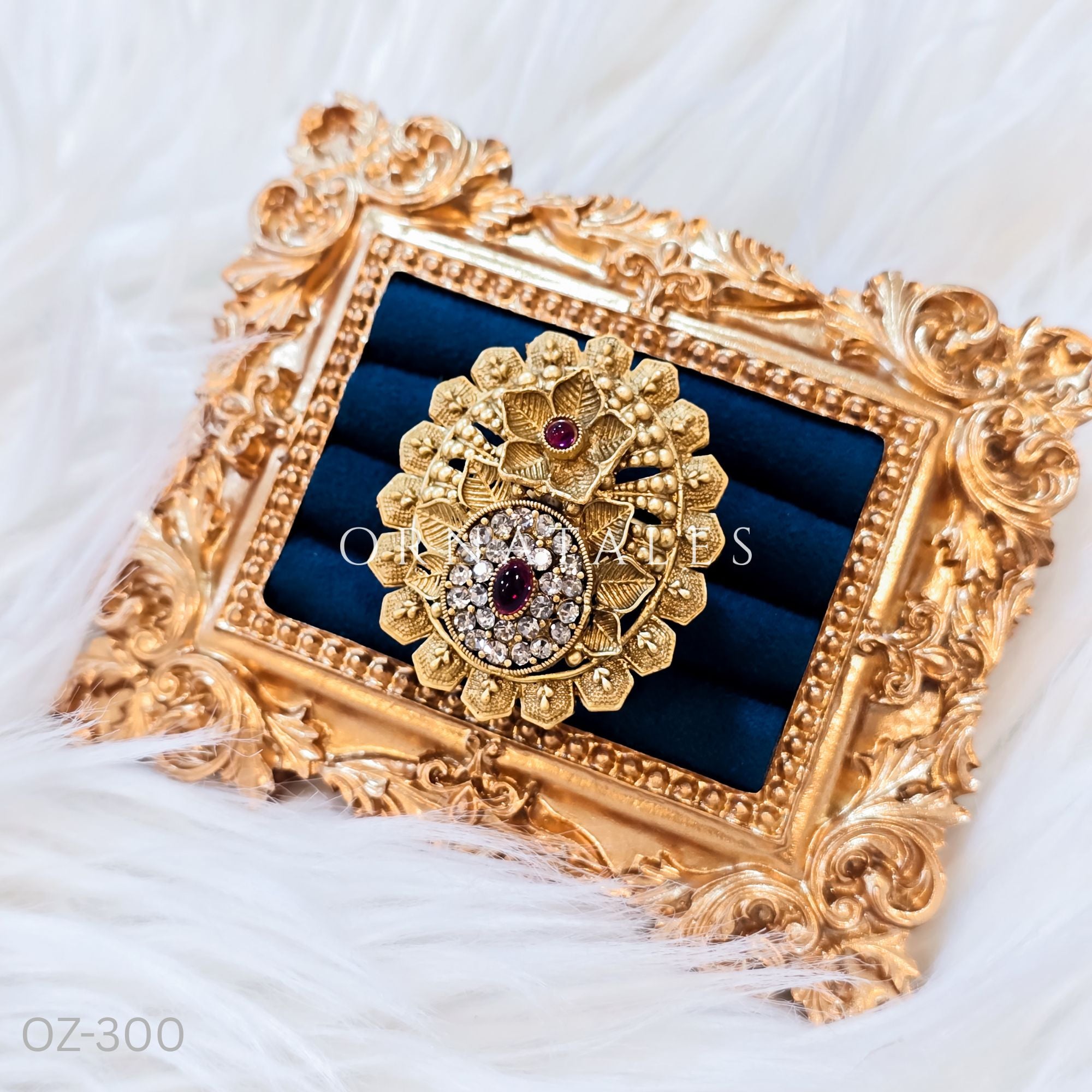 South Indian temple-inspired ring with matte gold finish, adjustable size, and traditional embossed motifs.