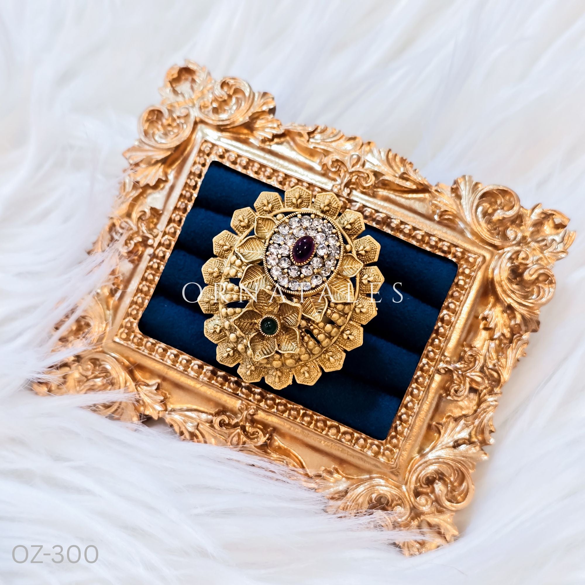 South Indian temple-inspired ring with matte gold finish, adjustable size, and traditional embossed motifs.