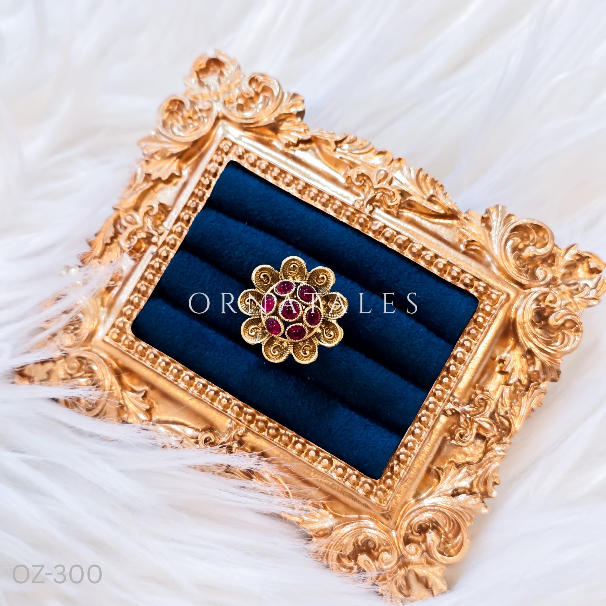 South Indian temple-inspired ring with matte gold finish, adjustable size, and traditional embossed motifs.