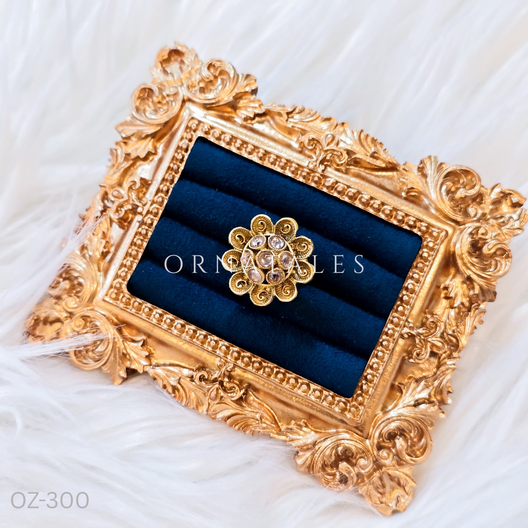 South Indian temple-inspired ring with matte gold finish, adjustable size, and traditional embossed motifs.