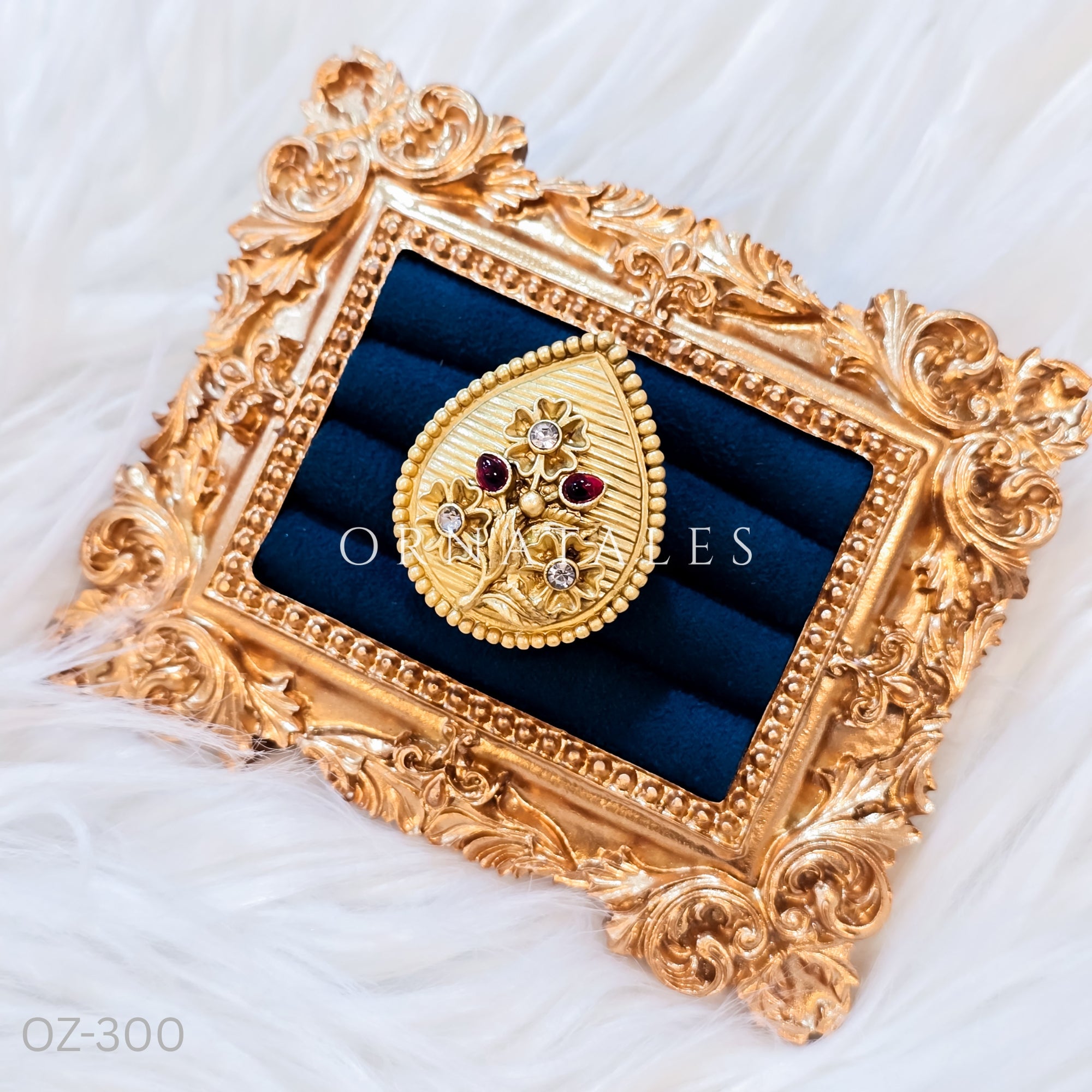 South Indian temple-inspired ring with matte gold finish, adjustable size, and traditional embossed motifs.