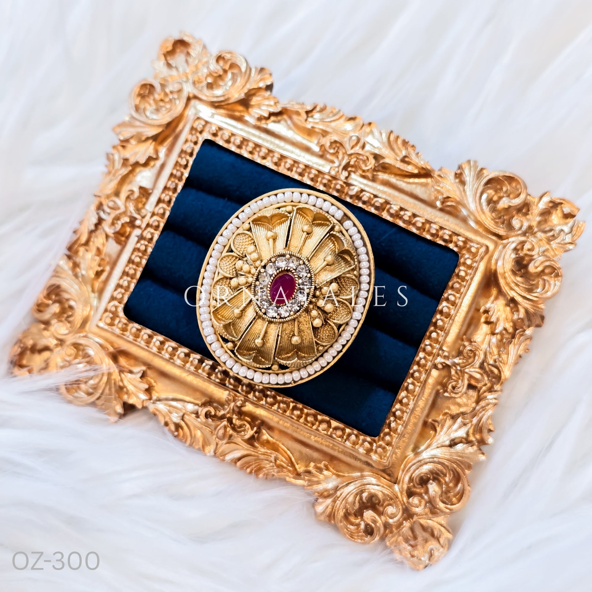 South Indian temple-inspired ring with matte gold finish, adjustable size, and traditional embossed motifs.