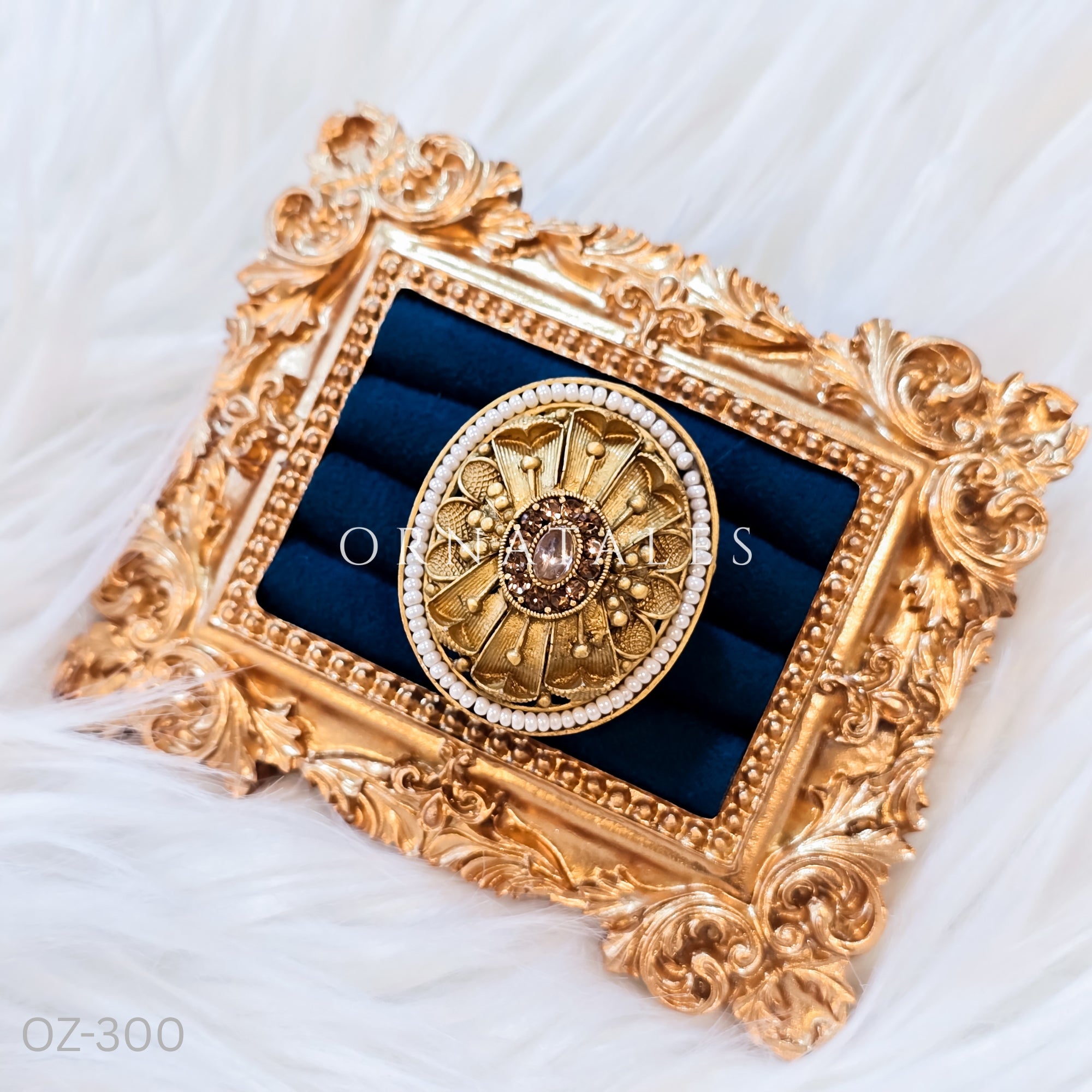 South Indian temple-inspired ring with matte gold finish, adjustable size, and traditional embossed motifs.