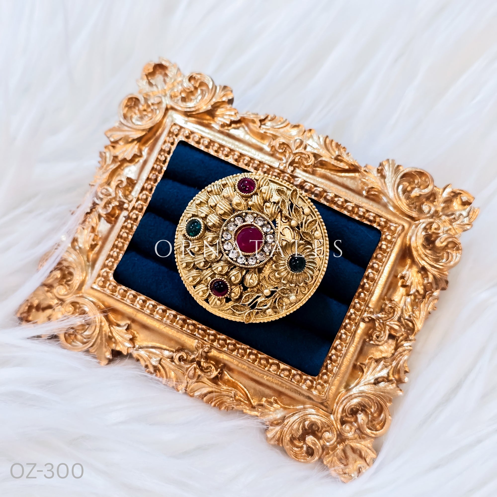 South Indian temple-inspired ring with matte gold finish, adjustable size, and traditional embossed motifs.