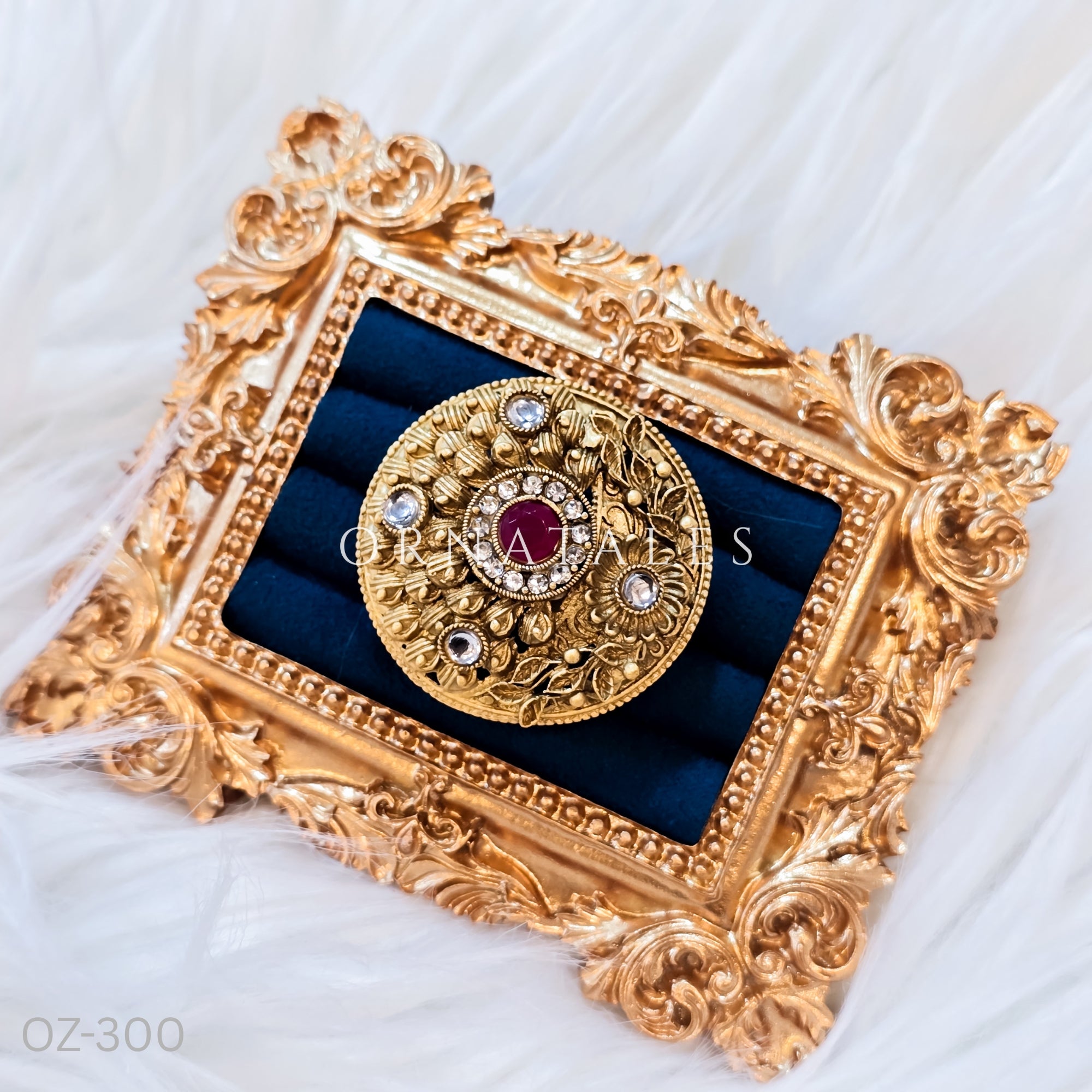 South Indian temple-inspired ring with matte gold finish, adjustable size, and traditional embossed motifs.