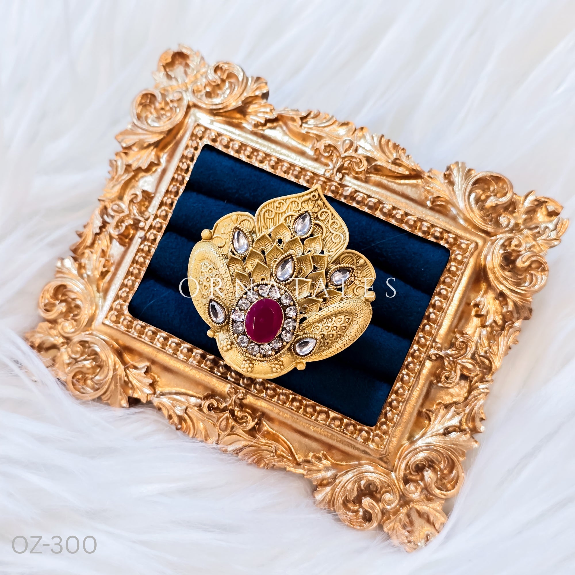 South Indian temple-inspired ring with matte gold finish, adjustable size, and traditional embossed motifs.