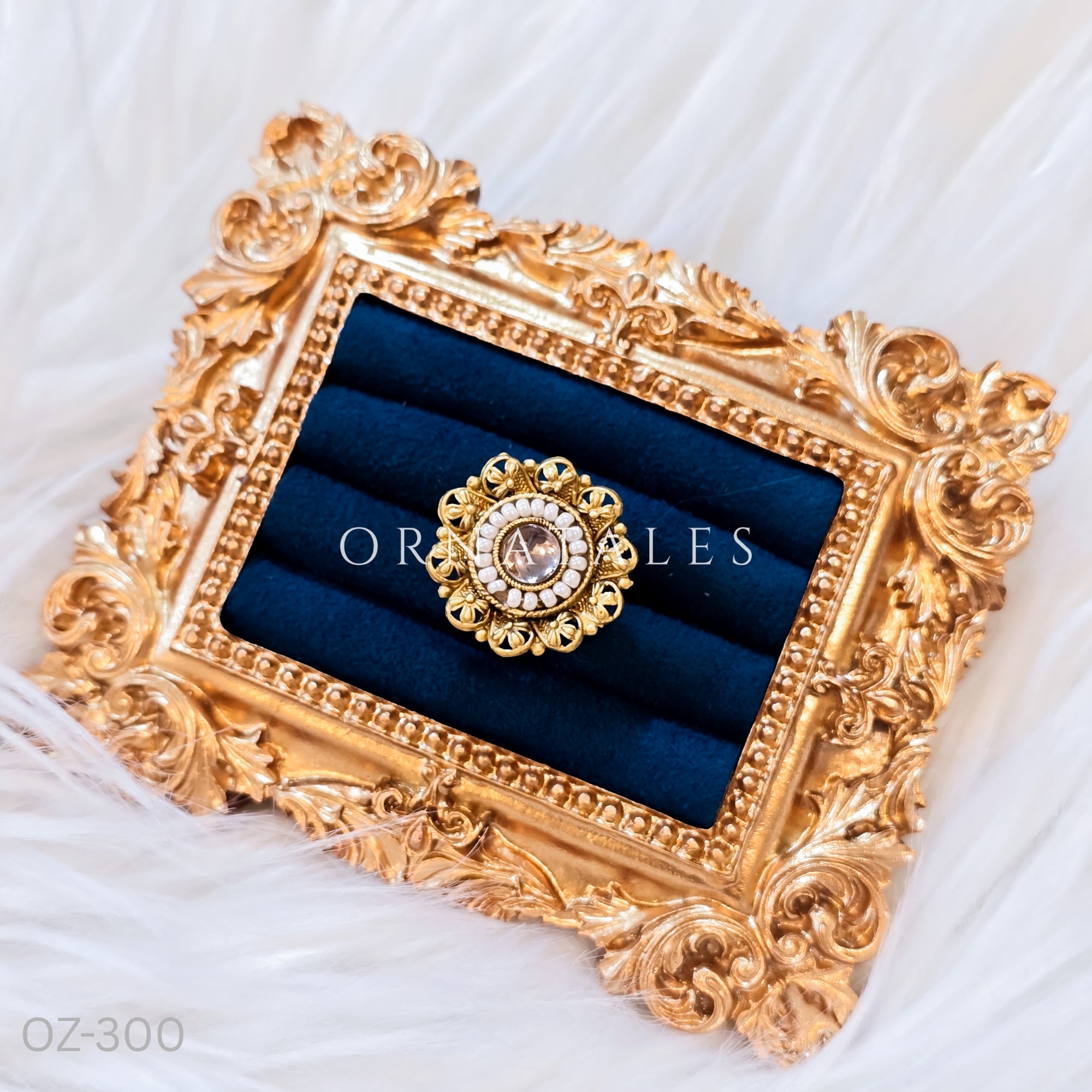 South Indian temple-inspired ring with matte gold finish, adjustable size, and traditional embossed motifs.