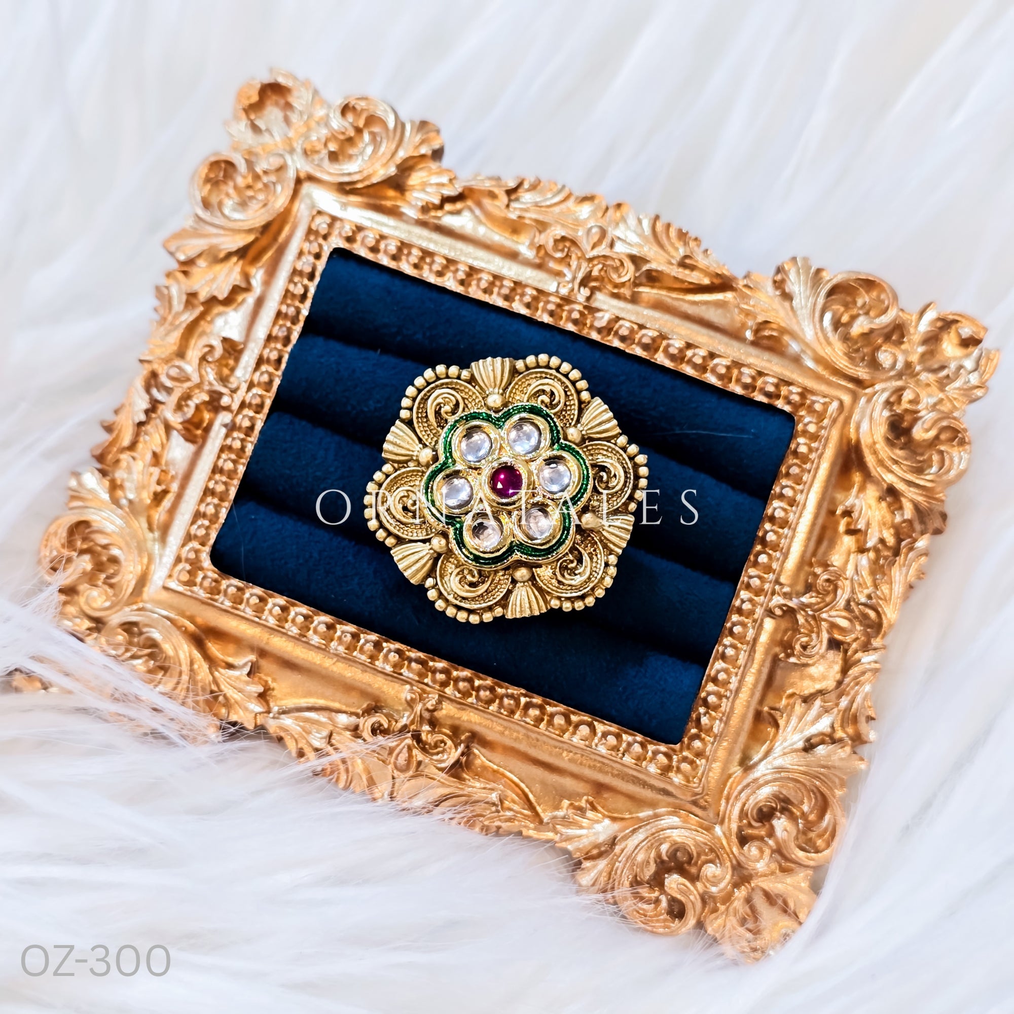 South Indian temple-inspired ring with matte gold finish, adjustable size, and traditional embossed motifs.