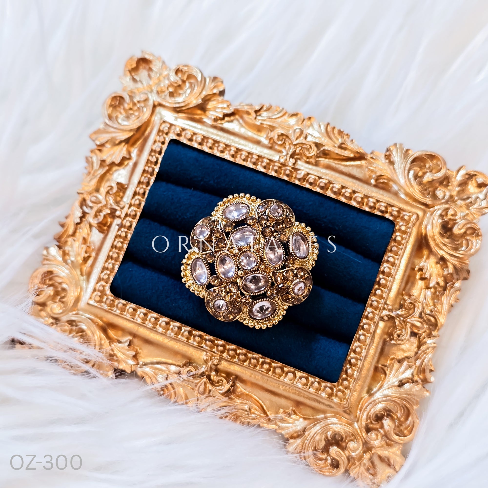 South Indian temple-inspired ring with matte gold finish, adjustable size, and traditional embossed motifs.