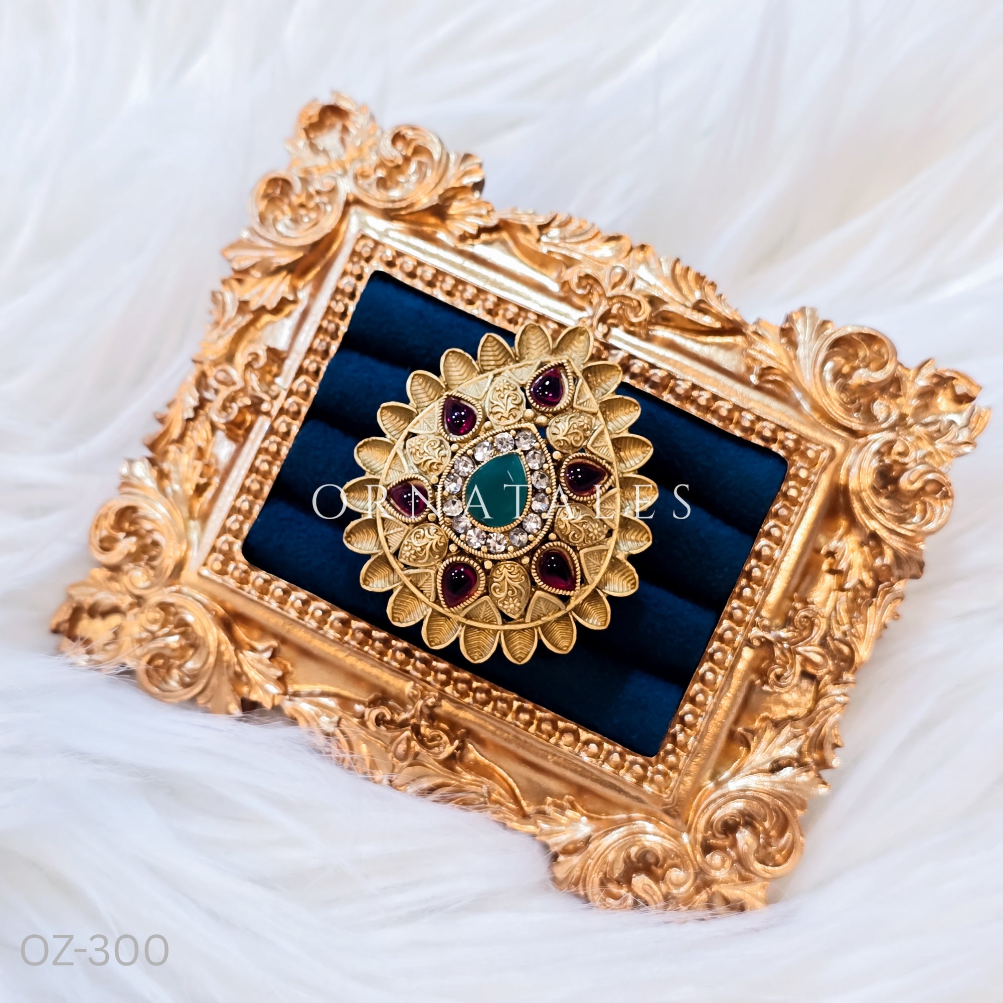 South Indian temple-inspired ring with matte gold finish, adjustable size, and traditional embossed motifs.