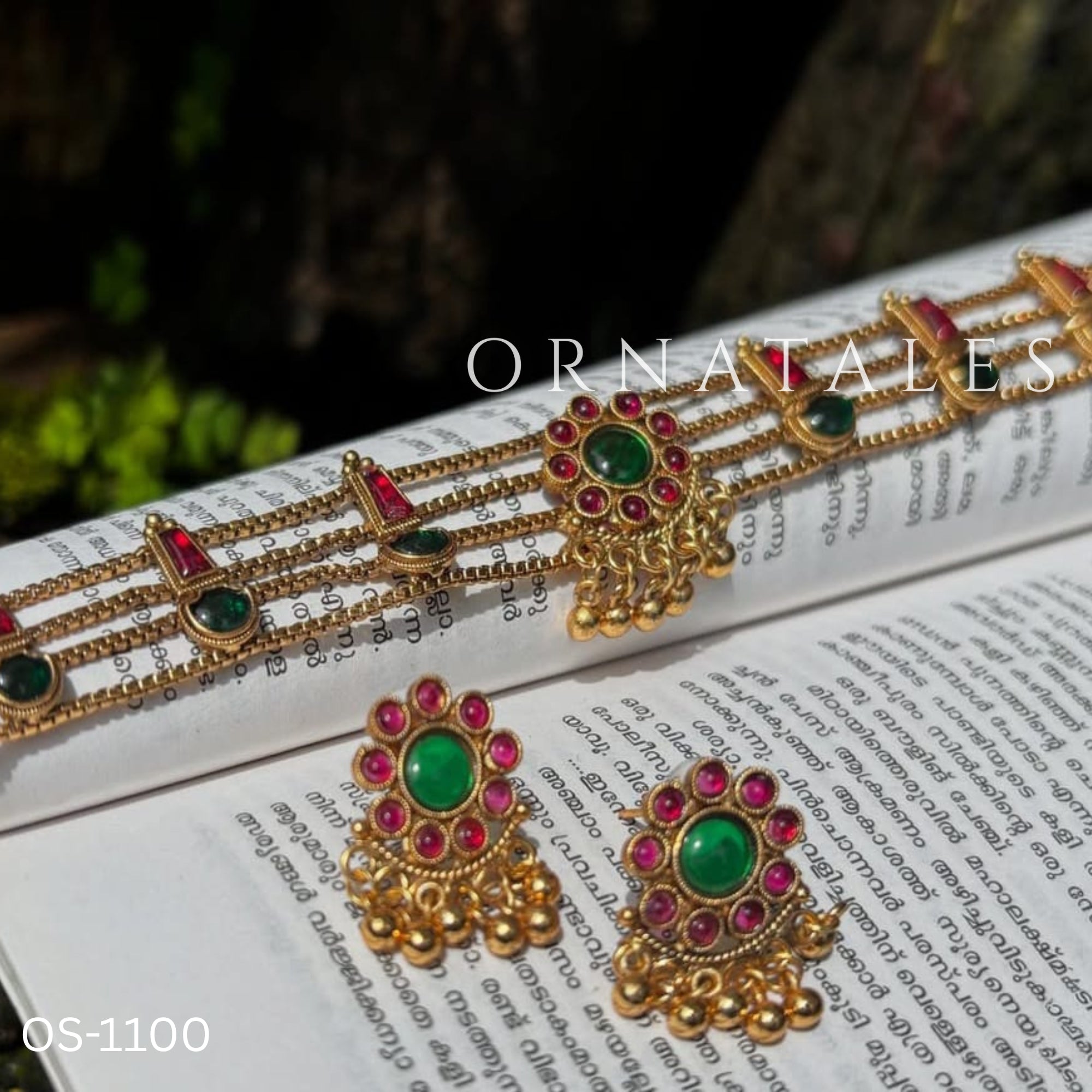Traditional ruby emerald kundan choker with crescent pendant, pearl hangings, antique gold finish, and matching earrings.