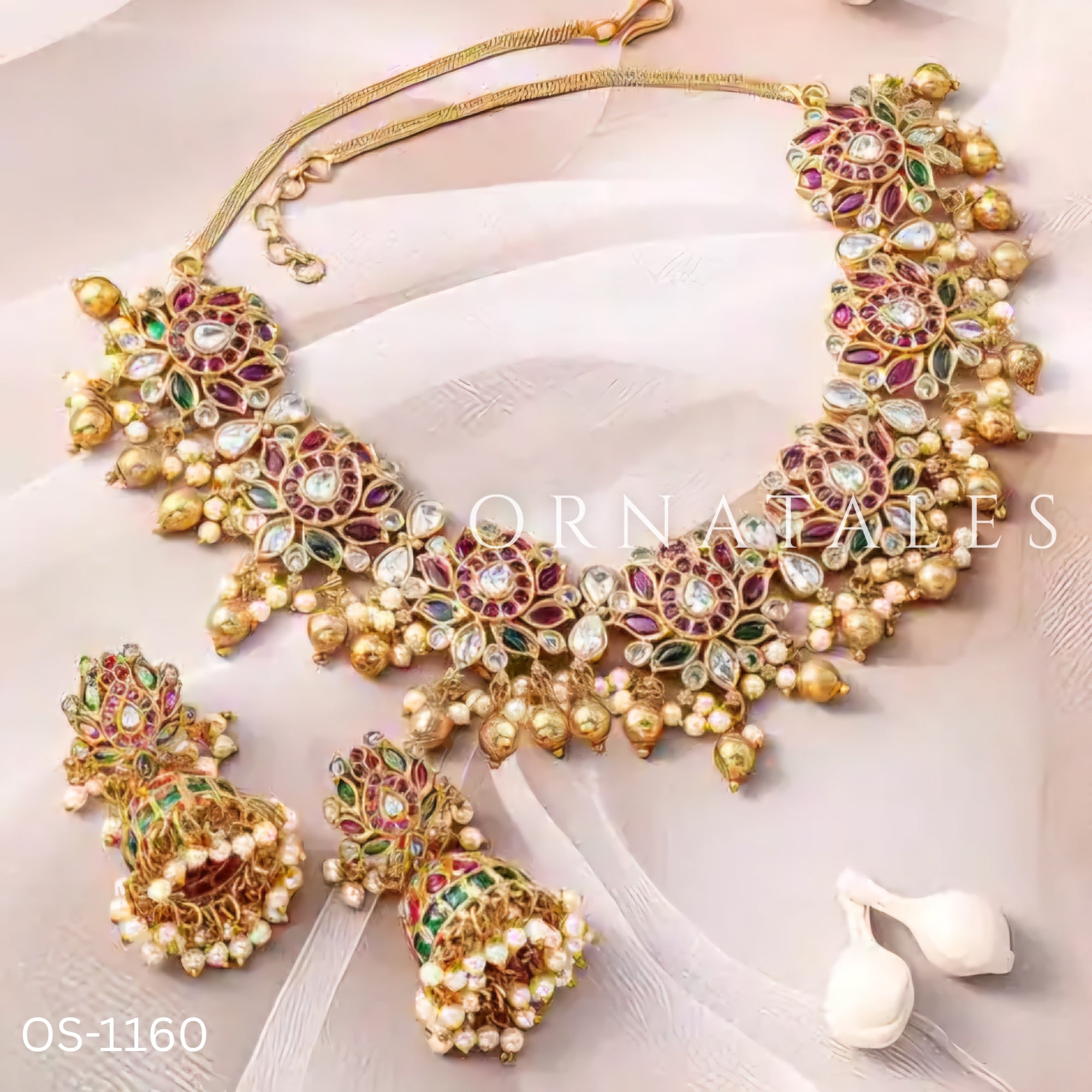 Padmarekha Heritage necklace set with pink-red lotus motif, green and white kundan stones, and golden pearl drops in temple jewellery style.