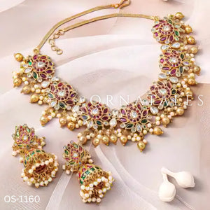 Padmarekha Heritage necklace set with pink-red lotus motif, green and white kundan stones, and golden pearl drops in temple jewellery style.