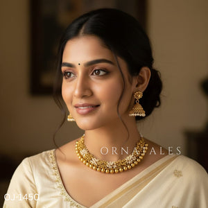 White and golden Gajra necklace set with layered micro pearls and golden ball beads in a traditional South Indian bridal design.