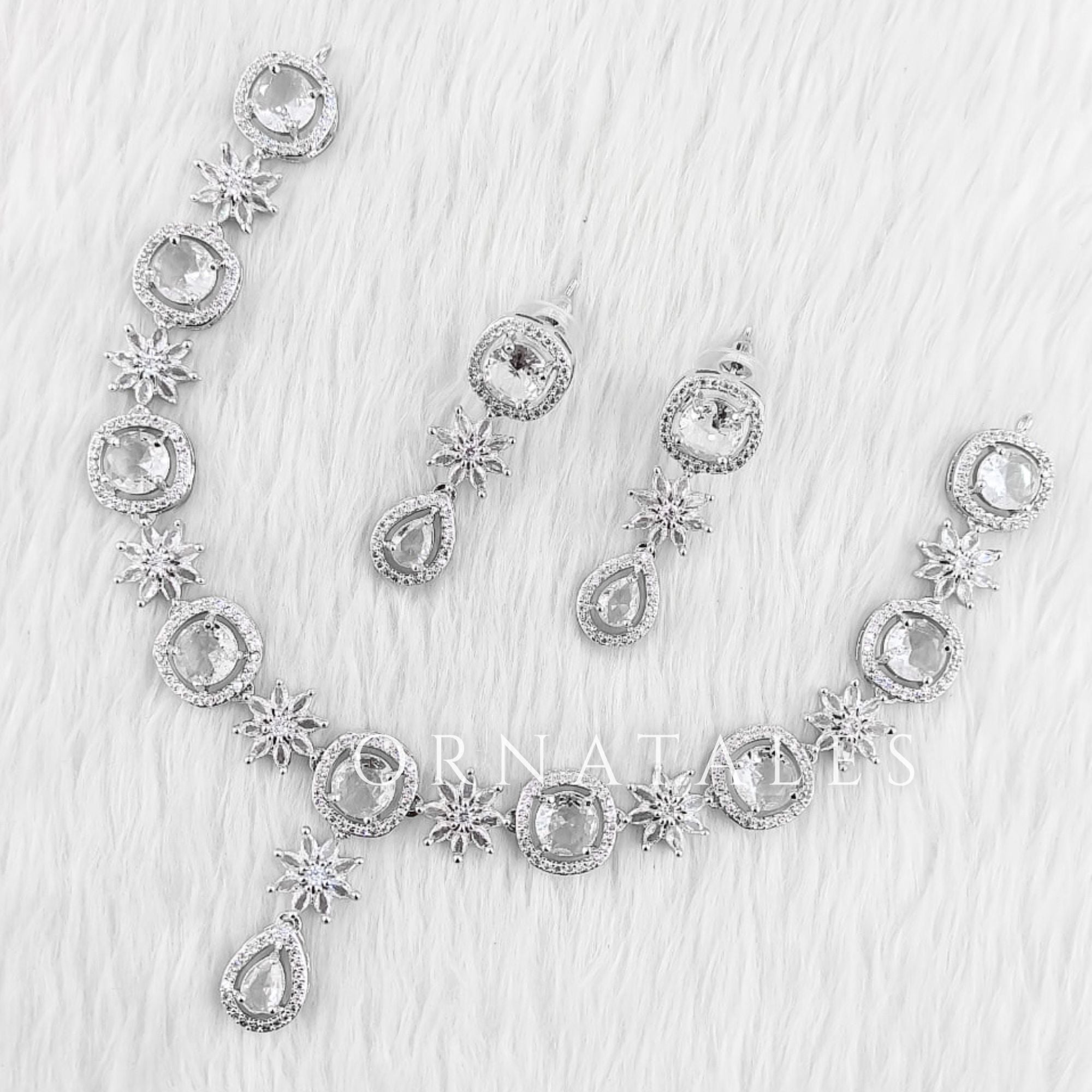 Crystal White Diamond Cut Necklace Set with starburst motif and teardrop design – Ornatales