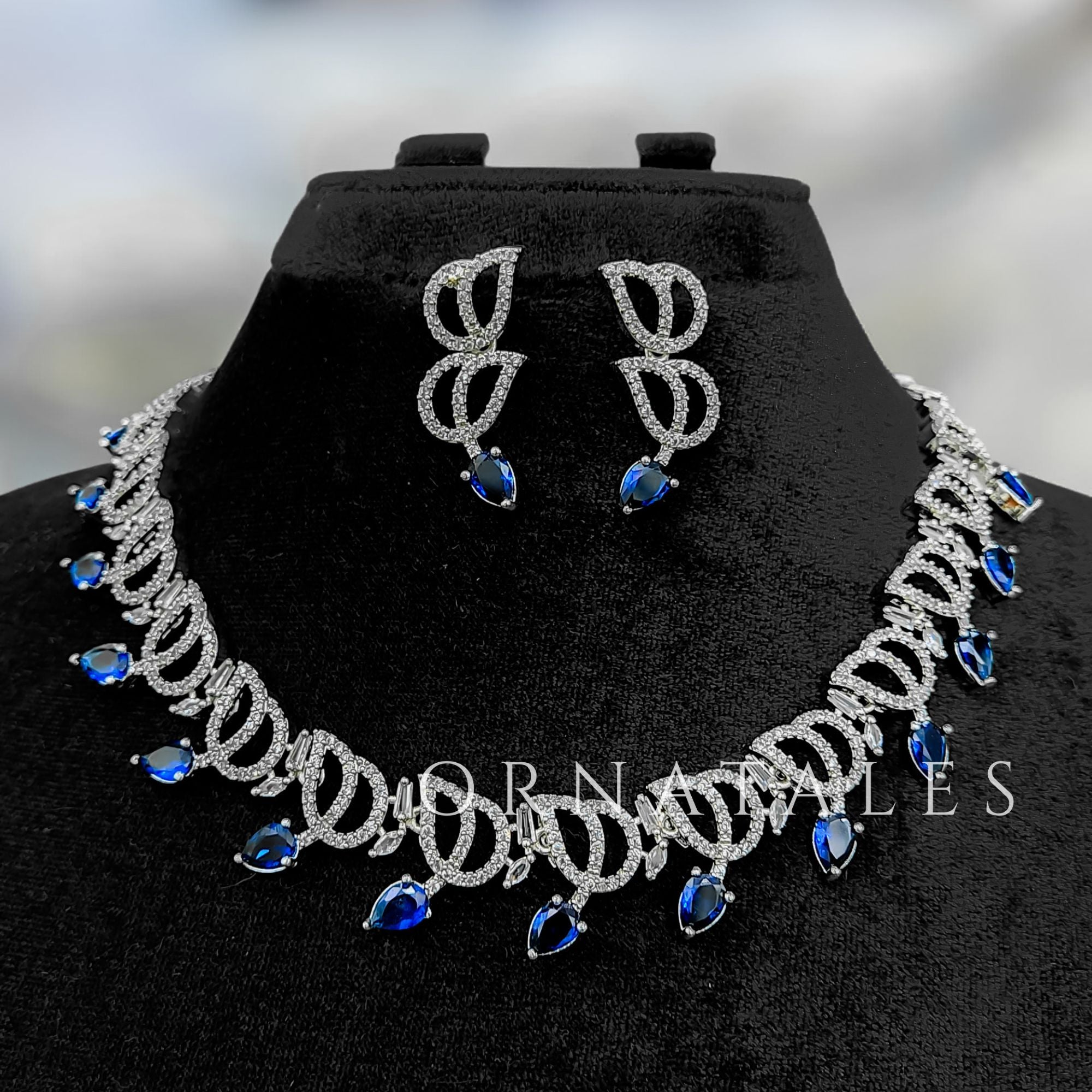 Royal Blue Diamond Cut Necklace Set with wave-like looping structure and droplet stones – matching earrings – Ornatales