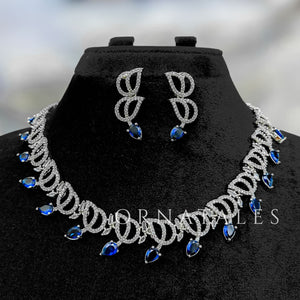 Royal Blue Diamond Cut Necklace Set with wave-like looping structure and droplet stones – matching earrings – Ornatales