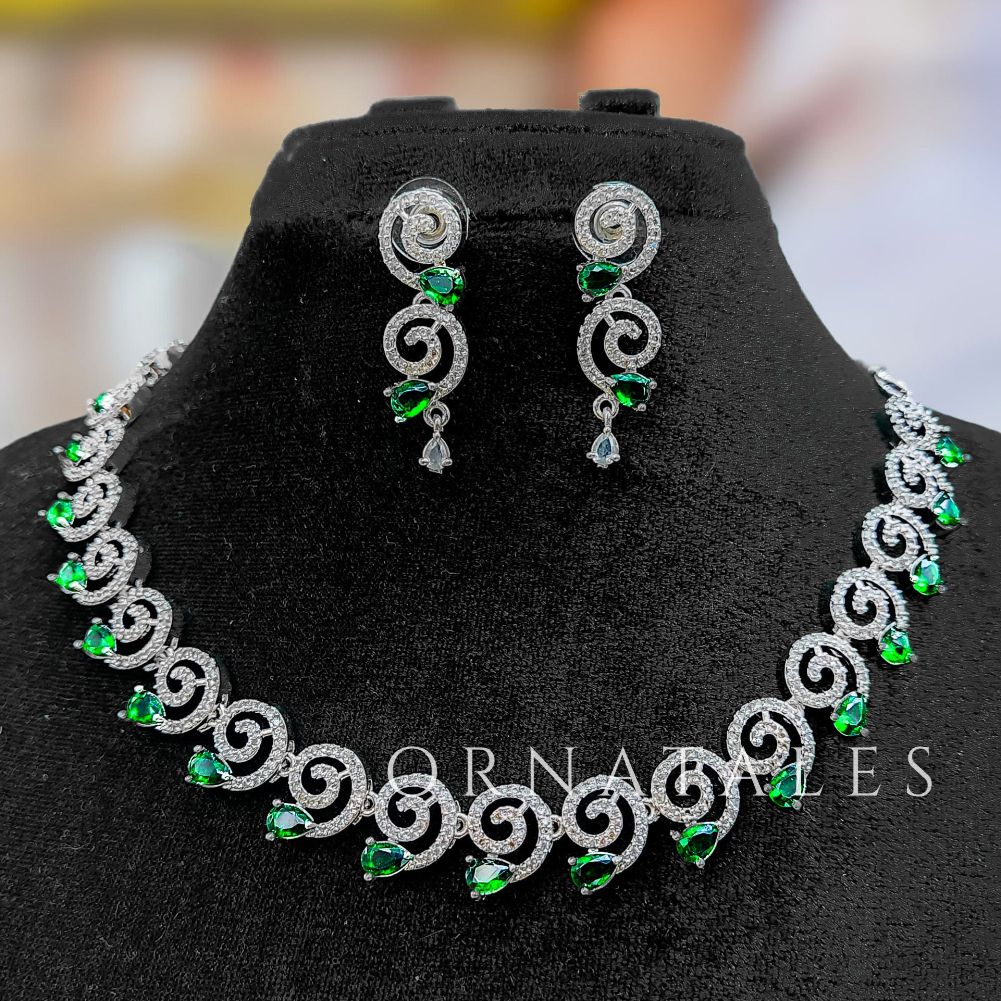 Emerald Green Diamond Cut Spiral Necklace Set with droplet stones and matching earrings – elegant swirl design – Ornatales