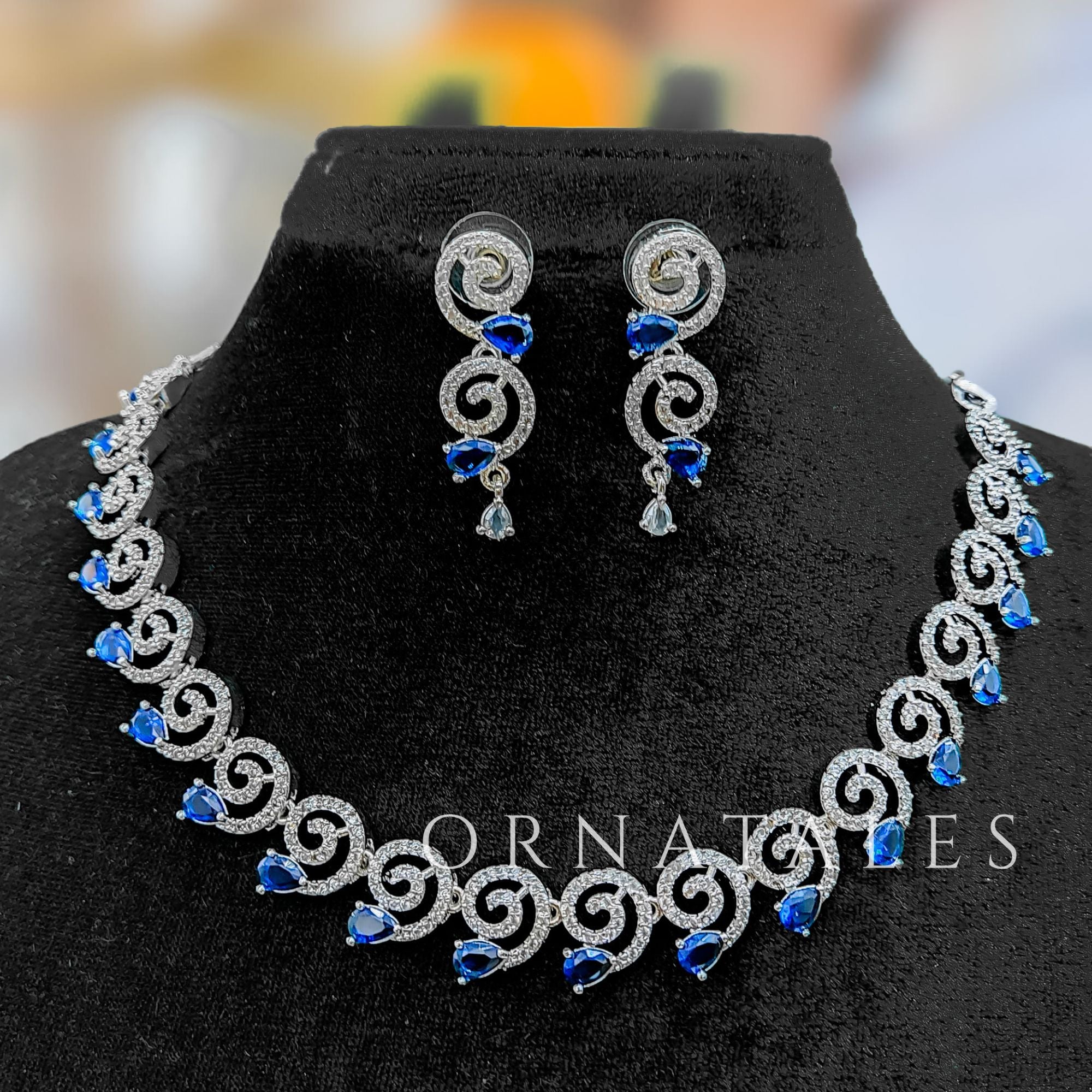 Royal Blue Diamond Cut Spiral Necklace Set with droplet stones and matching earrings – elegant swirl design – Ornatales