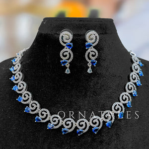 Royal Blue Diamond Cut Spiral Necklace Set with droplet stones and matching earrings – elegant swirl design – Ornatales