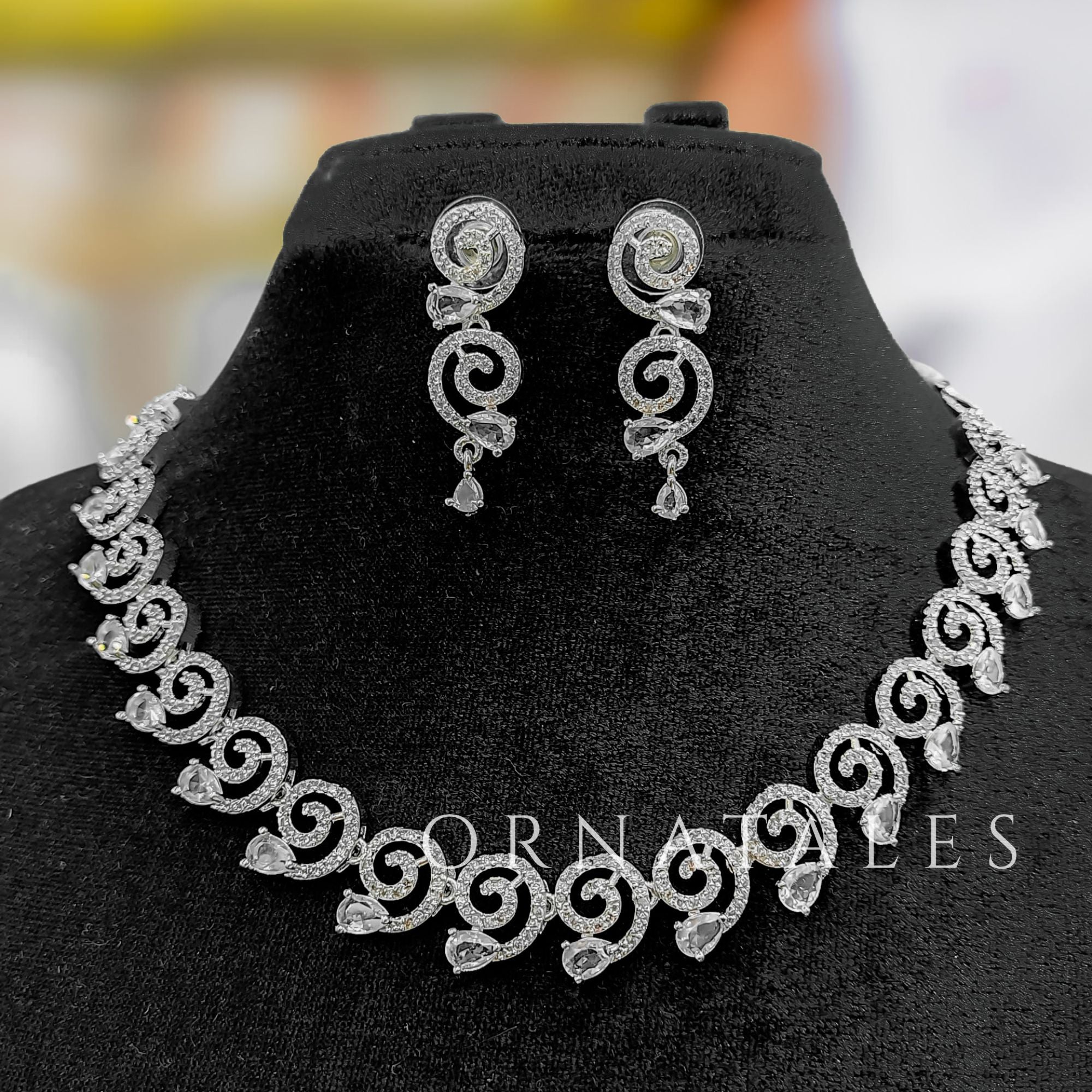 Crystal White Diamond Cut Spiral Necklace Set with droplet stones and matching earrings – elegant swirl design – Ornatales