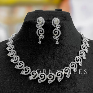 Crystal White Diamond Cut Spiral Necklace Set with droplet stones and matching earrings – elegant swirl design – Ornatales